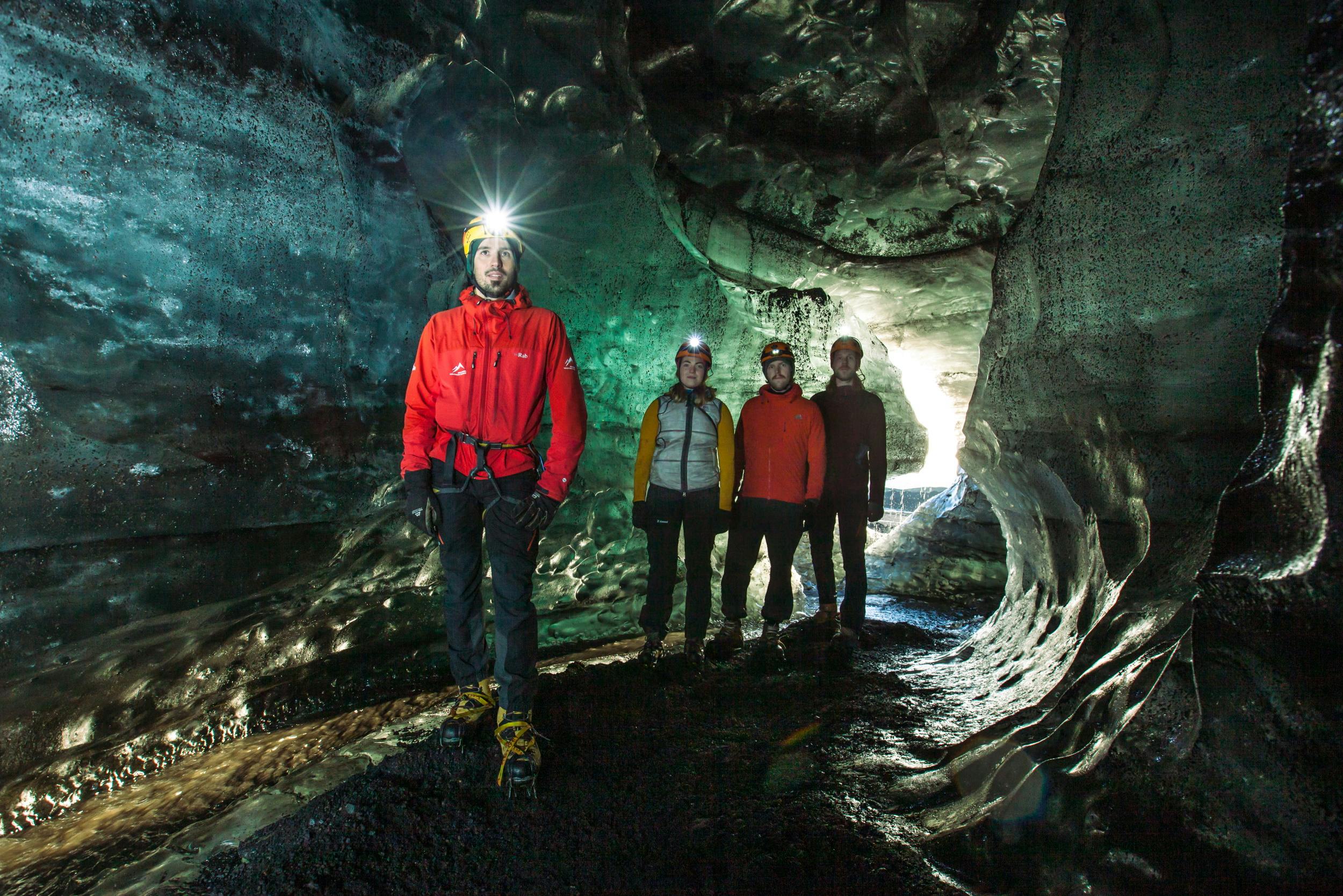 People exploring an ice cave